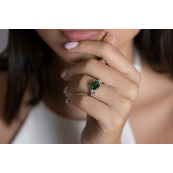 Platinum ring deals with green stone